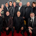 group of men in suits kneeling for a posed photo