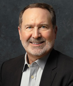 man in suit smiling