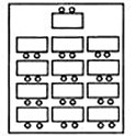 A classroom style set up has rows of tables with two or three chairs each facing the speaker at the front of the room