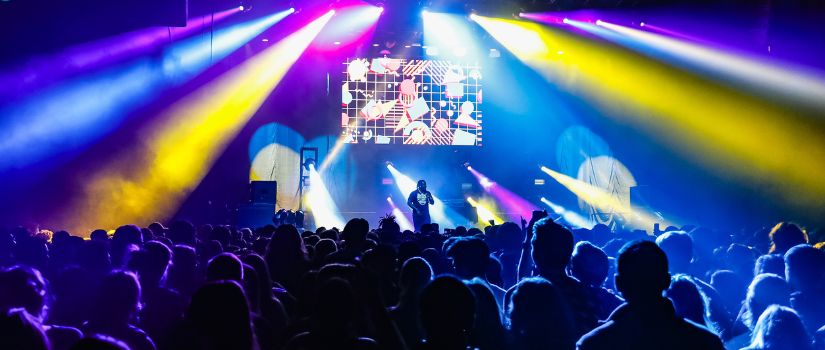 Picture from the Cockstock Homecoming Concert featuring T-Pain in Fall 2022. Crowd shot of students dancing while T-Pain is performing on stage.