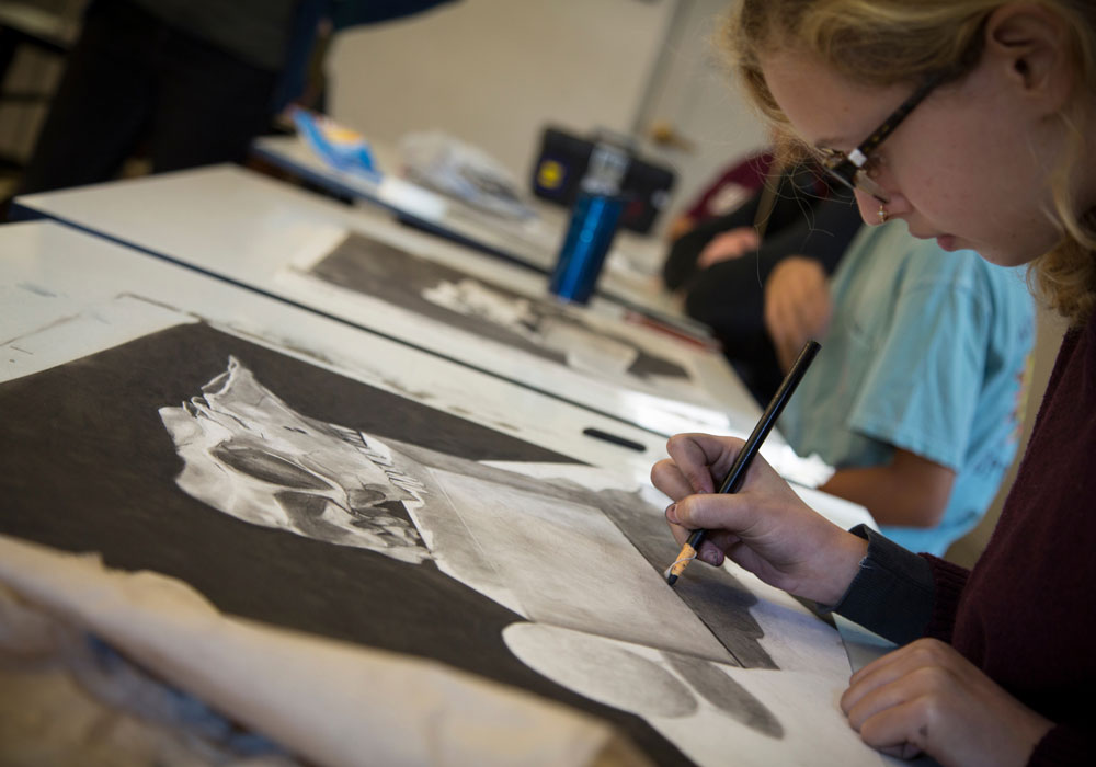 student sketching in an art class