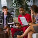 Students and professor talking in a circle