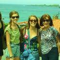 Group of students in front of the sea. 