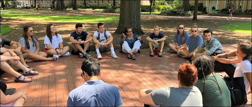 Nikky Finney having class on a warm sunny day on the horseshoe