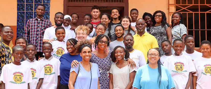 group posing outside a library