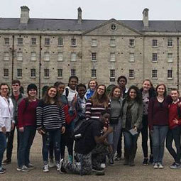 students smiling while on a trip 