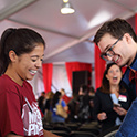 Two students talking at the fair