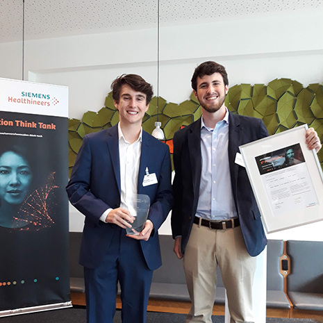 kevin gagnon and Jack pose with award