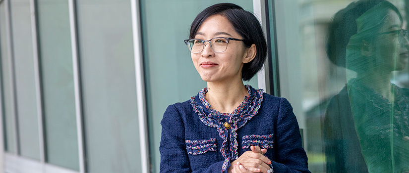 Lucy Yu stands in the Swearingen Courtyard