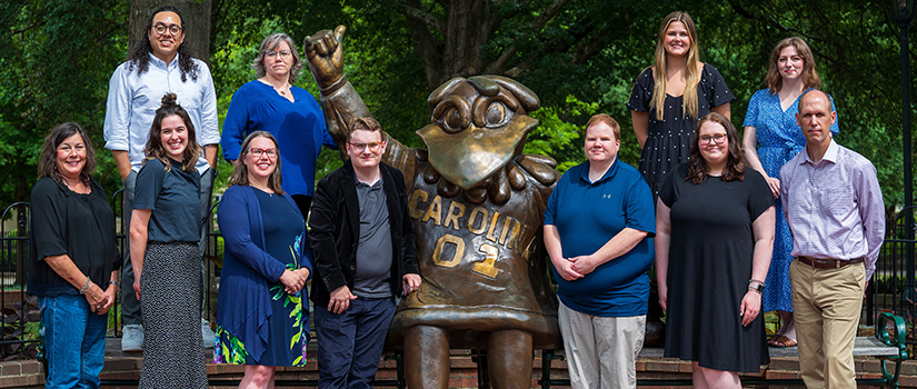 Top row, from left, Moe Fadel, Carrie Turner, Ryanne Keefe, Sam McMillion. Bottom row, from left, Wanda Mujica, Allison Brillhart, Sarah Jusiewicz, Cocky, Erik Martin, Andrew Winterfeldt, Kate Snelson, Shane Prater.