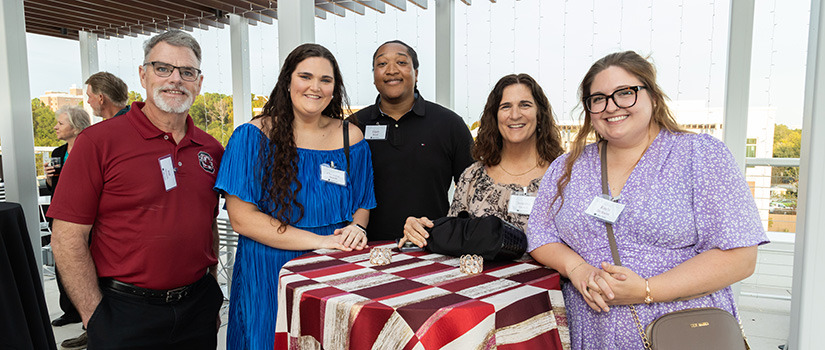 christina storch with family at party on the patio 