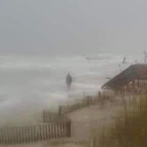 picture of beach with gray figure