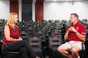 Hannah Horn talking with Shane Beamer.