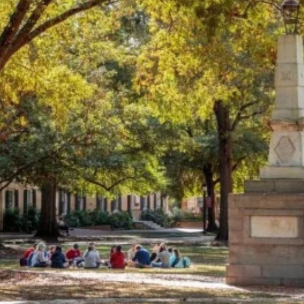Students sit on the USC Horseshoe