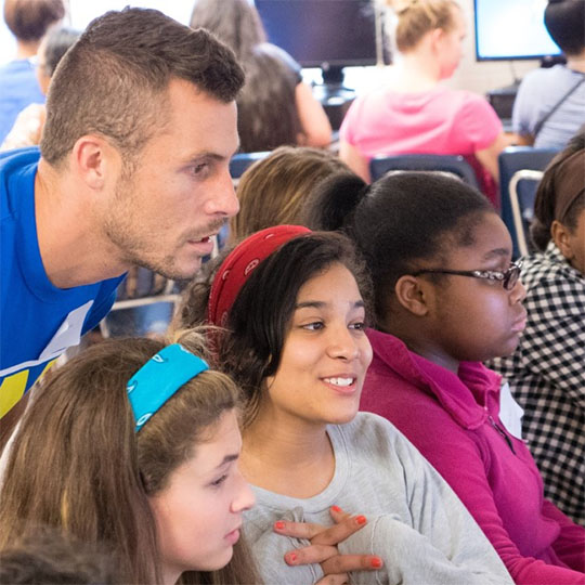 teacher with students in computer lab