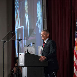 UofSC President Bob Caslen is flanked by the U.S. and SC flags as he makes his State of the University address