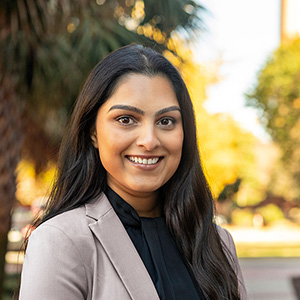 Poorva Dalvi standing outside.