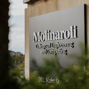 black sign reading molinaroli college of engineering and computing, 301 main st