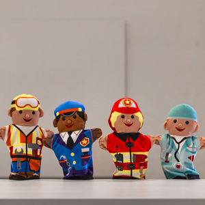Four career-themed hand puppets used in play therapy activities stand on a table.