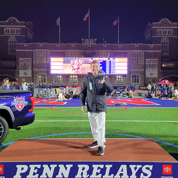 Ian Piihl on a podium at the Penn Relays track meet